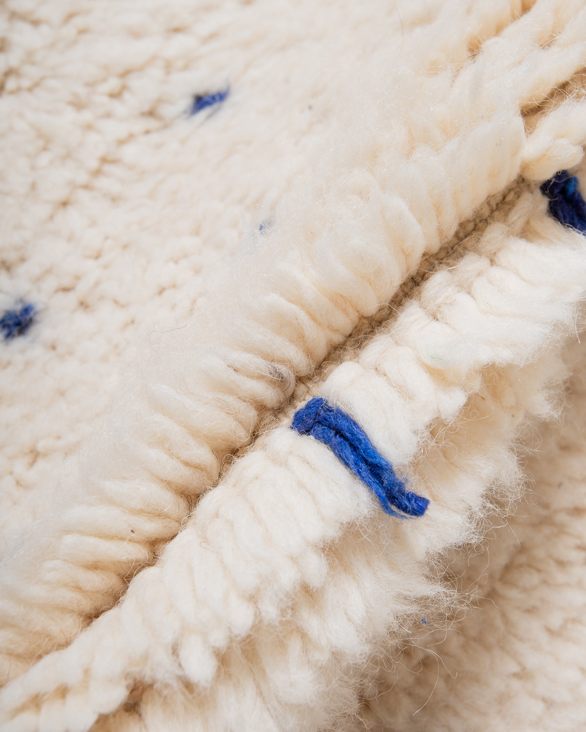 Modern, designer, handcrafted Berber rug from Morocco. Beniourain carpet with beautiful colours and patterns and fluffy wool texture.